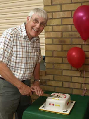 Dave Bowers cutting the cake made in his honour